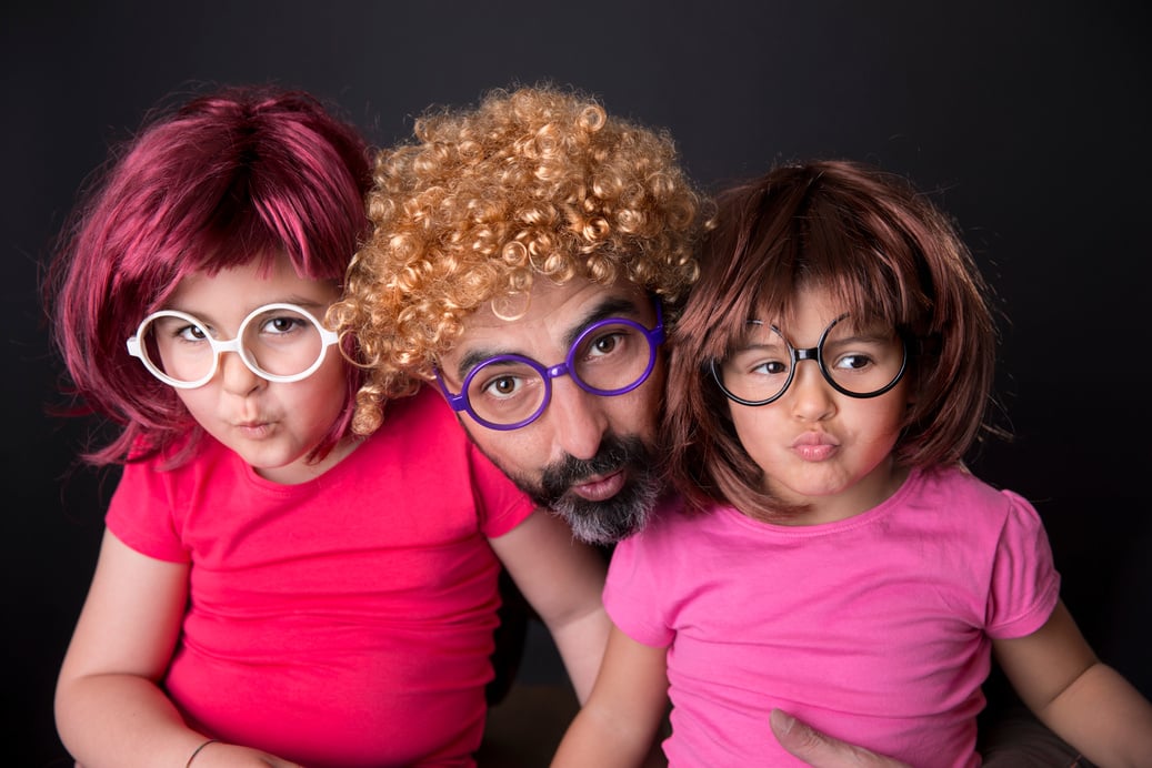 Father and children in wigs